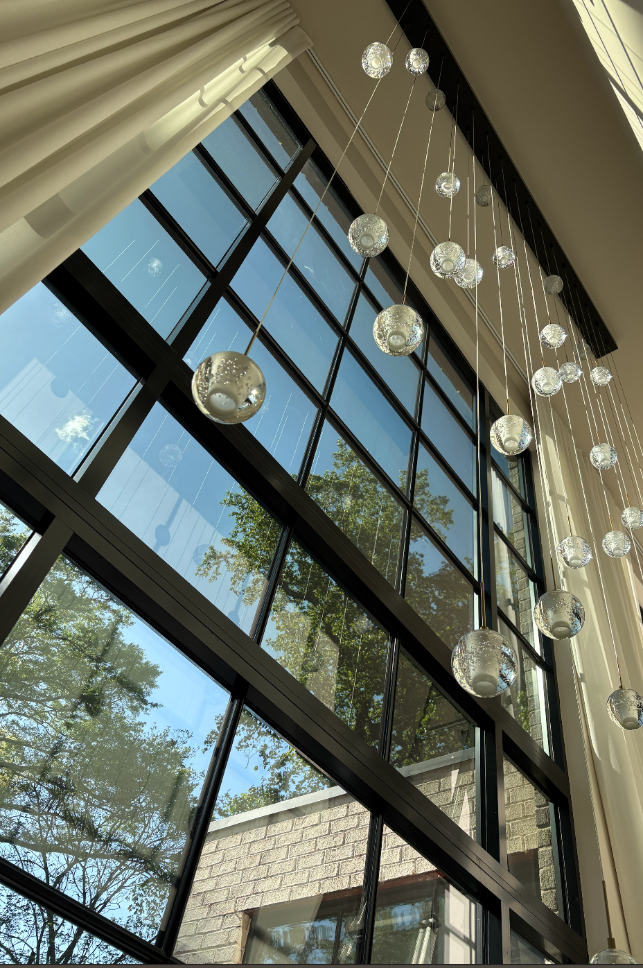Luxury interior with floor-to-ceiling windows and Hüper Optik window film