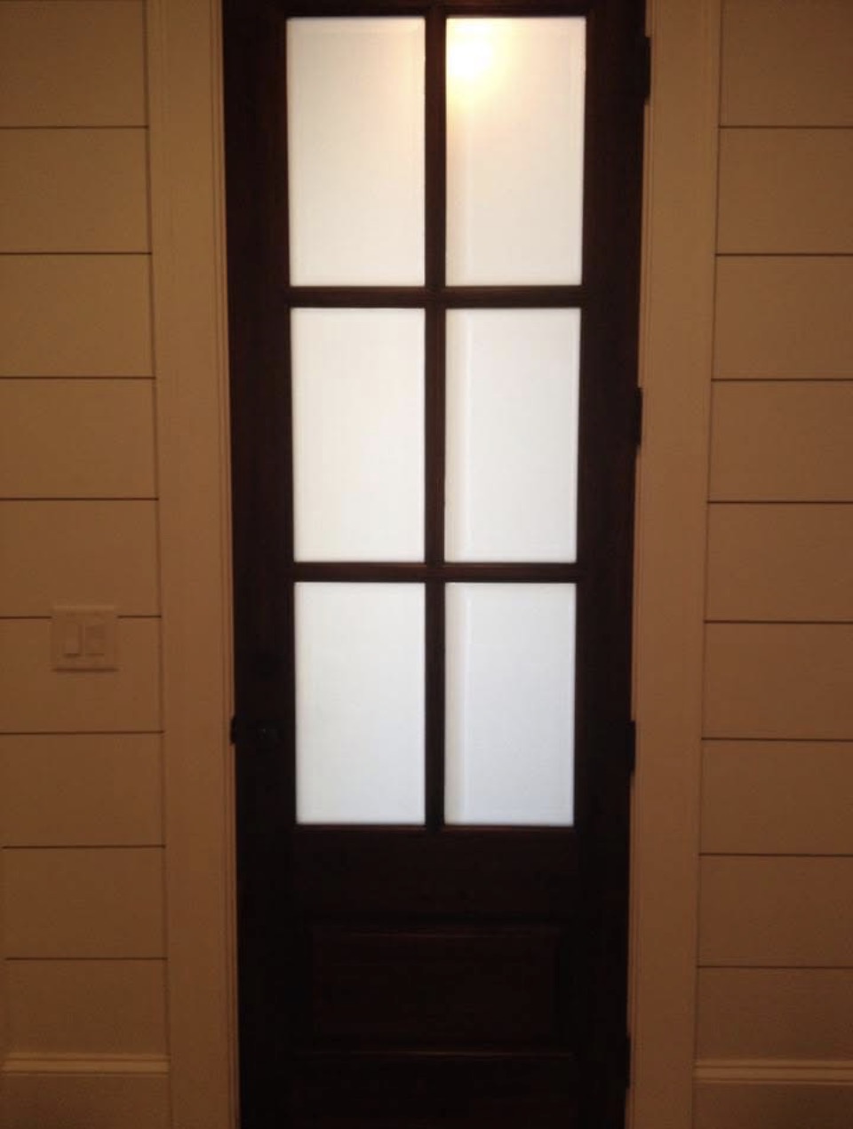 Interior French door with frosted privacy film on all six glass panels