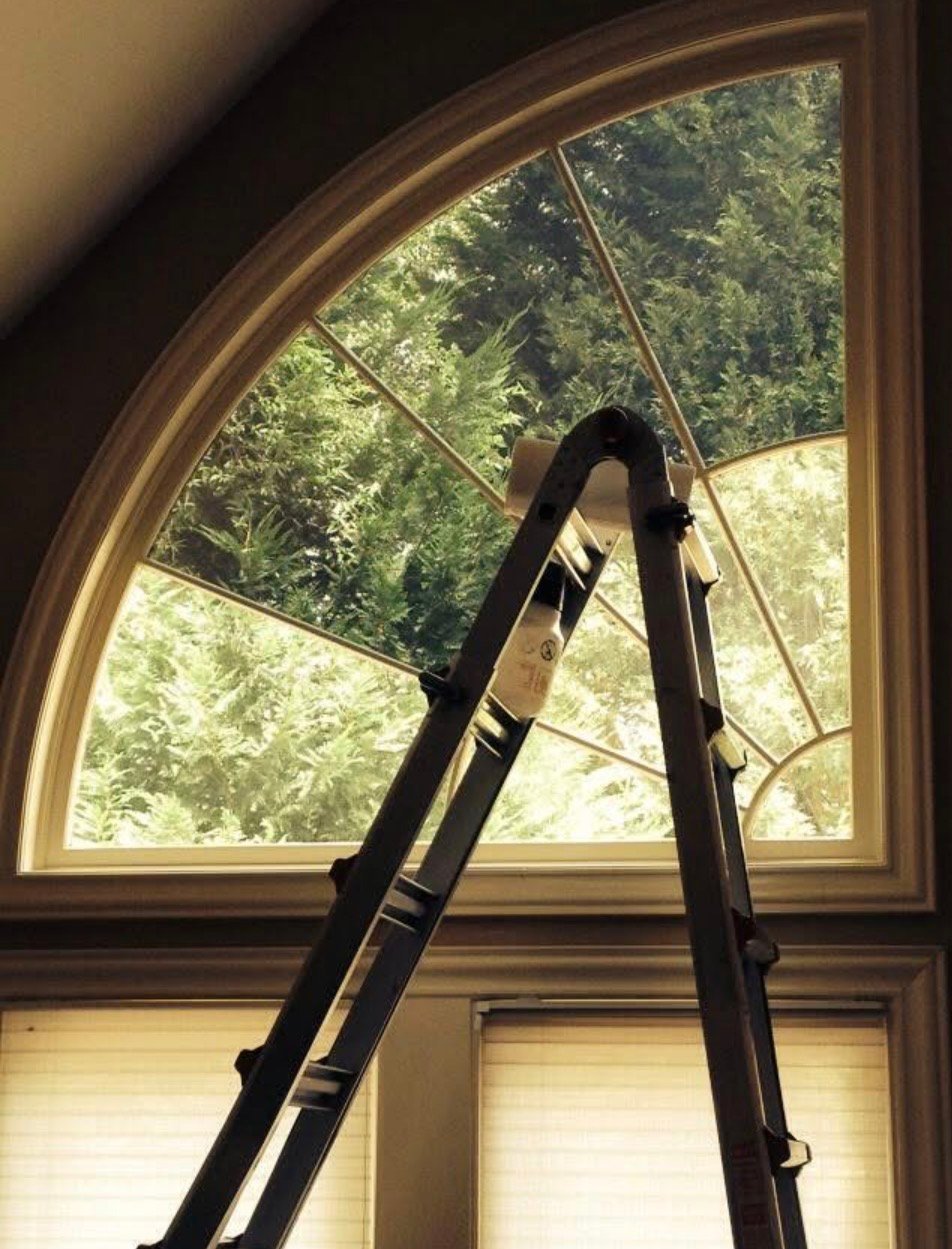 High-rise commercial window tinting with Atlanta skyline view