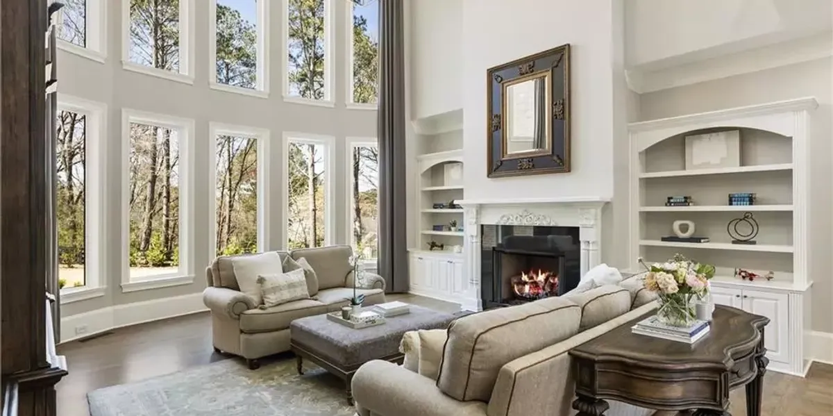 Bright living room with floor-to-ceiling tinted windows