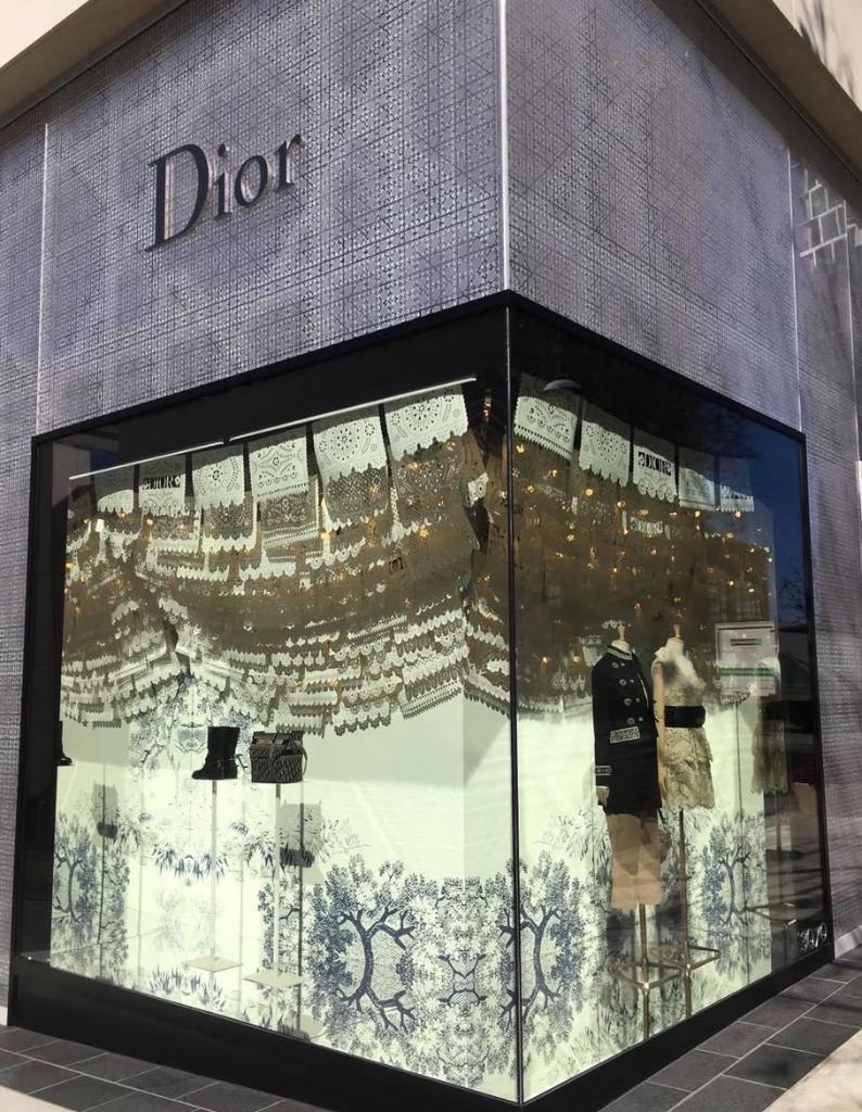 Dior luxury boutique storefront with decorative window film