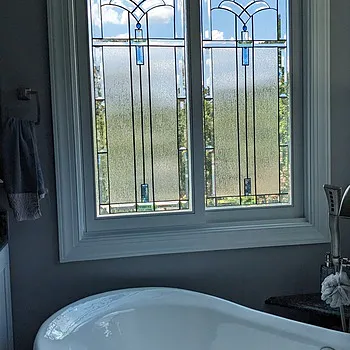 Bathroom tub window with sx2 decorative leaded glass arch pattern film